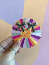 Load image into Gallery viewer, Titanium Stripped Bow Studs