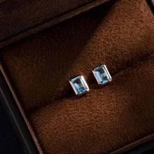 Load image into Gallery viewer, Blue Topaz Stud Earrings 14K Yellow Gold Emerald Cut