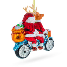Load image into Gallery viewer, Santa and Reindeer Riding a Tandem Bike Glass Christmas Ornament