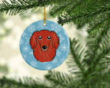 Load image into Gallery viewer, Snowflake Longhair Red Dachshund Ornament - Round Ceramic Ornament – Artist-Designed Keepsake Decoration BB1648CO1