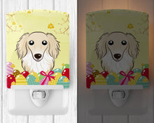 Load image into Gallery viewer, Longhair Creme Dachshund Easter Egg Hunt Ceramic Night Light BB1894CNL