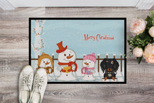 Load image into Gallery viewer, Merry Christmas Carolers Wire Haired Dachshund Dapple Doormat - 24x36 Decorative Floor Mat – Indoor/Outdoor Rug with Artistic Flair BB2459JMAT