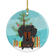 Load image into Gallery viewer, Merry Christmas Tree Dachshund Black Tan Ornament - Round Ceramic Ornament – Artist-Designed Keepsake Decoration BB4257CO1