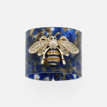 Load image into Gallery viewer, Stripey bee resin napkin rings, blue tortoiseshell, set of four