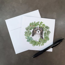 Load image into Gallery viewer, Cavalier King Charles Spaniel Tricolor Head Tilt with Christmas Wreath Square Greeting Cards -  Blank Note Cards – 8-Pack of Artist-Designed Cards with Envelopes