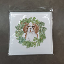 Load image into Gallery viewer, Cavalier King Charles Spaniel Blenheim Puppy Smiling with Christmas Wreath Square Greeting Cards -  Blank Note Cards – 8-Pack of Artist-Designed Cards with Envelopes
