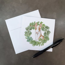 Load image into Gallery viewer, Ibizan Hound Sitting Tall with Christmas Wreath Square Greeting Cards -  Blank Note Cards – 8-Pack of Artist-Designed Cards with Envelopes