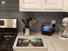 Load image into Gallery viewer, Marigold Spooky Halloween Glass Cutting Boards – Durable, Decorative Kitchen Art Large