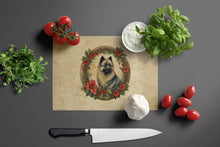 Load image into Gallery viewer, Keeshond Christmas Flowers Glass Cutting Boards – Durable, Decorative Kitchen Art