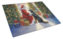 Load image into Gallery viewer, Flat-Coated Retriever and Santa Claus Glass Cutting Boards – Durable, Decorative Kitchen Art