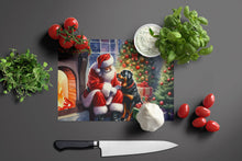 Load image into Gallery viewer, Rottweiler and Santa Claus Glass Cutting Boards – Durable, Decorative Kitchen Art