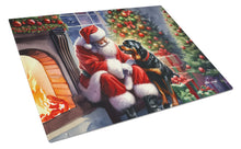 Load image into Gallery viewer, Rottweiler and Santa Claus Glass Cutting Boards – Durable, Decorative Kitchen Art