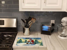 Load image into Gallery viewer, Sheltie and Santa Claus Glass Cutting Boards – Durable, Decorative Kitchen Art