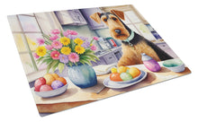 Load image into Gallery viewer, Decorating Easter Airedale Terrier Glass Cutting Boards – Durable, Decorative Kitchen Art