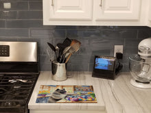 Load image into Gallery viewer, Decorating Easter Keeshond Glass Cutting Boards – Durable, Decorative Kitchen Art