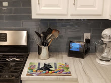Load image into Gallery viewer, Decorating Easter Scottish Terrier Glass Cutting Boards – Durable, Decorative Kitchen Art