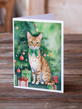 Load image into Gallery viewer, Ocicat Cat By the Christmas Tree Greeting Cards - Blank Note Cards – 8-Pack of Artist-Designed Cards with Envelopes