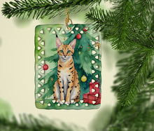Load image into Gallery viewer, Serengeti Cat By the Christmas Tree Porcelain Ornament