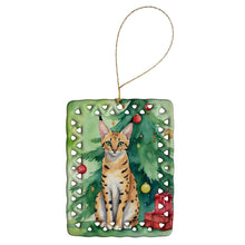Load image into Gallery viewer, Serengeti Cat By the Christmas Tree Porcelain Ornament