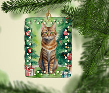 Load image into Gallery viewer, Sokoke Cat By the Christmas Tree Porcelain Ornament