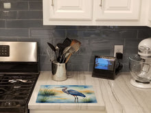 Load image into Gallery viewer, Blue Heron Emerging as the day fades Glass Cutting Boards – Durable, Decorative Kitchen Art