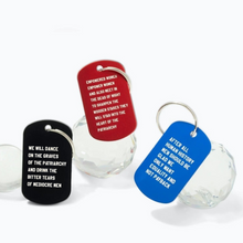 Load image into Gallery viewer, Dance on the Graves of the Patriarchy Dog Tag Keychain in Black, Laser Engraved