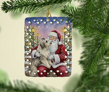 Load image into Gallery viewer, Bearded Collie with Santa Claus Porcelain Ornament
