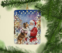 Load image into Gallery viewer, Collie with Santa Claus Porcelain Ornament