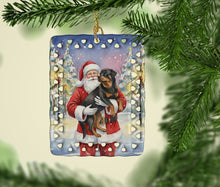 Load image into Gallery viewer, Rottweiler with Santa Claus Porcelain Ornament