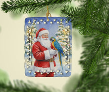 Load image into Gallery viewer, Blue and Gold Macaw Parrot with Santa Claus Porcelain Ornament