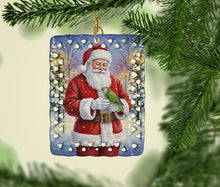 Load image into Gallery viewer, Green Quaker Parrot with Santa Claus Porcelain Ornament