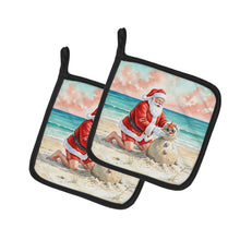 Load image into Gallery viewer, Santa Claus Building a Sand Snowman Christmas Pair of Pot Holders