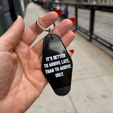 Load image into Gallery viewer, It's Better To Arrive Late, Than To Arrive Ugly Keychain in Black and White
