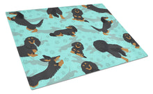 Load image into Gallery viewer, Longhaired Black Tan Dachshund Glass Cutting Boards – Durable, Decorative Kitchen Art Large