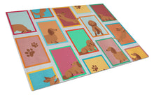 Load image into Gallery viewer, Lots of Longhaired Red Dachshund Glass Cutting Boards – Durable, Decorative Kitchen Art Large