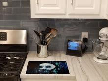 Load image into Gallery viewer, Cryptic Mask Glass Cutting Boards – Durable, Decorative Kitchen Art
