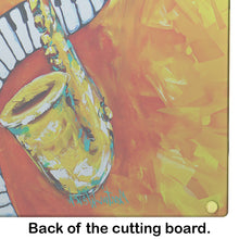 Load image into Gallery viewer, Something Blues Saxaphone and Piano Glass Cutting Boards – Durable, Decorative Kitchen Art