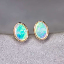 Load image into Gallery viewer, Minimalist Oval Australian Solid Opal Stud Earrings 14k Yellow Gold