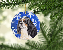 Load image into Gallery viewer, Cavalier Spaniel Winter Snowflakes Holiday Ornament - Round Ceramic Ornament – Artist-Designed Keepsake Decoration SC9391