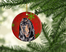 Load image into Gallery viewer, Black and Tan Coonhound Red Snowflakes Holiday Ceramic Ornament SC9581CO1