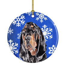 Load image into Gallery viewer, Black and Tan Coonhound Winter Snowflakes Ornament - Round Ceramic Ornament – Artist-Designed Keepsake Decoration SC9595CO1