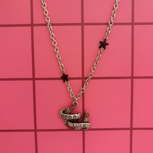 Load image into Gallery viewer, Sourpuss "Good Luck” Horseshoe Necklace with Red Rhinestones &amp; Black Star Charms