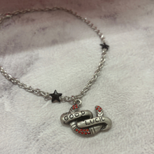 Load image into Gallery viewer, Sourpuss "Good Luck” Horseshoe Necklace with Red Rhinestones &amp; Black Star Charms