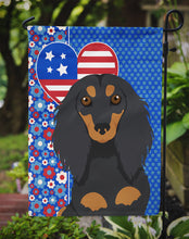 Load image into Gallery viewer, Longhair Black and Tan Dachshund Patriotic Heart Garden Flag – Red, White &amp; Blue Dog Decor with Star Background