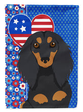 Load image into Gallery viewer, Longhair Black and Tan Dachshund Patriotic Heart Garden Flag – Red, White &amp; Blue Dog Decor with Star Background