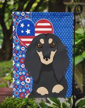 Load image into Gallery viewer, Longhair Black and Cream Dachshund Patriotic Heart Garden Flag – Red, White &amp; Blue Dog Decor with Star Background