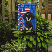 Load image into Gallery viewer, Black and Cream Dachshund Patriotic Heart Garden Flag – Red, White &amp; Blue Dog Decor with Star Background