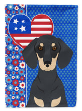 Load image into Gallery viewer, Black and Cream Dachshund Patriotic Heart Garden Flag – Red, White &amp; Blue Dog Decor with Star Background