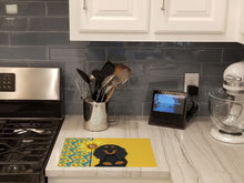 Load image into Gallery viewer, Summer Sunflowers Longhair Black and Tan Dachshund Glass Cutting Boards – Durable, Decorative Kitchen Art Large