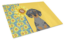 Load image into Gallery viewer, Summer Sunflowers Black Dapple Dachshund Glass Cutting Boards – Durable, Decorative Kitchen Art Large
